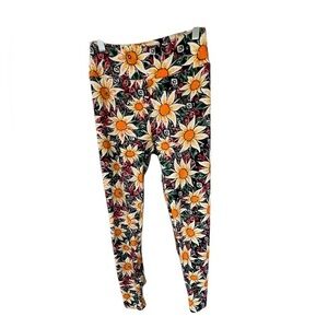 LuLaRoe  Leggings with Yellow sunflowers ontop of a green and red design.